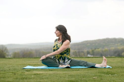 Karen Noel demonstrating a yoga pose.